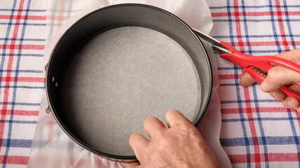 cuts a circle of parchment