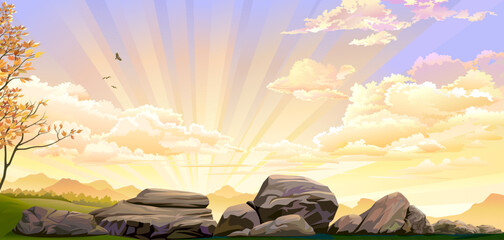Big rocks on green meadows with sunset in the background.