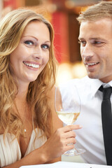 Love, couple and champagne for celebration, happiness and achievement outdoor, romance and joyful. Portrait, man and woman with alcohol, wine glass and Valentines day date, relationship and smile