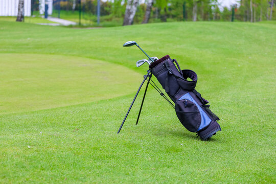 The Golf club bag for golfer training and play in game with golf course background , green tree rays. 