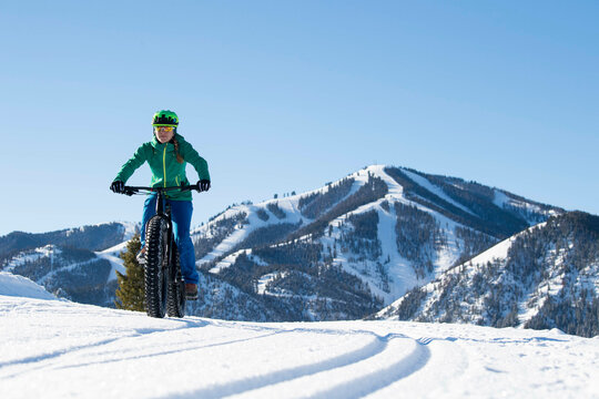 A woman riding her fat bike on a beautiful winter day in Sun Valley.