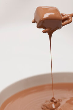 chocolate dripping of praline on white background