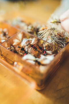 Close up photo of an assorted box of artificial flies
