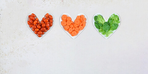 Heart Month Concept with Vegetables on Heart Shaped Plates, Plenty of Copy Space