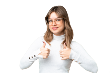 Young girl over isolated chroma key background With glasses and with thumb up