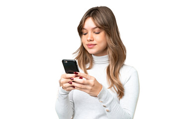 Young girl over isolated chroma key background sending a message or email with the mobile