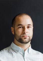 Fototapeta premium portrait of a thirty-year-old businessman in jeans and a shirt