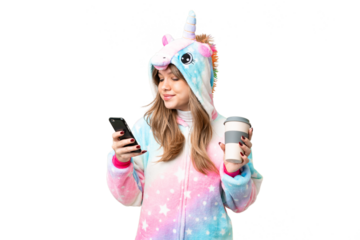 Young girl with unicorn pajamas over isolated chroma key background holding coffee to take away and a mobile