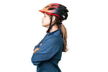 Young cyclist girl over isolated chroma key background in lateral position