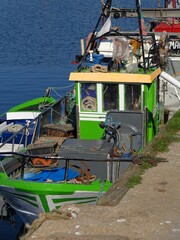 Fototapeta na wymiar Colorful traditional fishing boat in the Nazare Marina, Centro - Portugal 