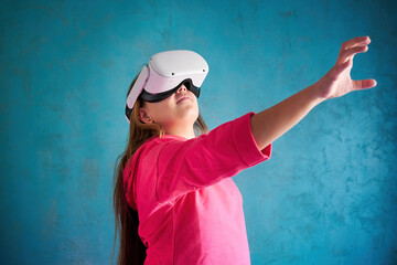 little girl playing with VR glasses