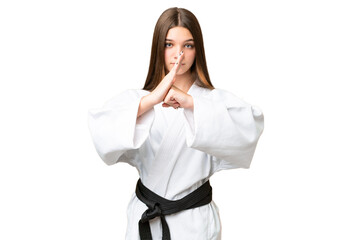 Teenager girl over isolated chroma key background doing karate and saluting