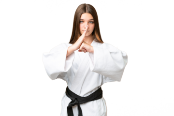 Teenager girl over isolated chroma key background doing karate and saluting