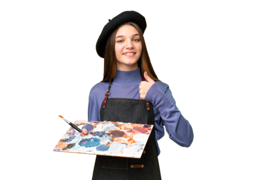 Young artist man holding a palette over isolated chroma key background giving a thumbs up gesture - Powered by Adobe