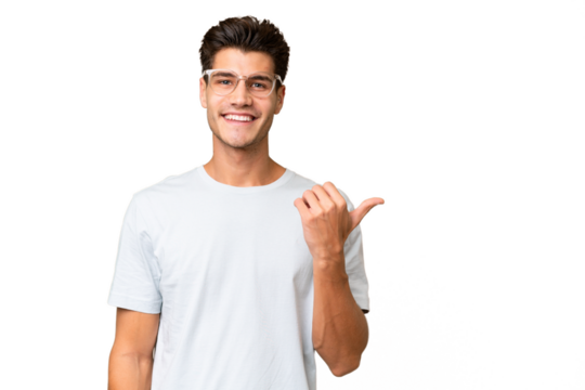 Young caucasian handsome man over isolated background pointing to the side to present a product