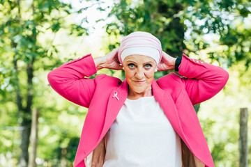 Strong and happy woman overcoming cancer