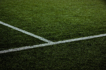 White lines on the football lawn under the spotlight