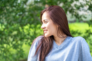 Portrait of smiling cheerful beautiful pretty asian woman clean fresh healthy white skin posing smile in pajamas clothes.Girl felling relax and enjoy time on green background at home.asia beauty