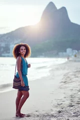 Fotobehang beautiful young brazilian woman on the shore of the beach full body portrait Ipanema, Rio de Janeiro  © oscargutzo