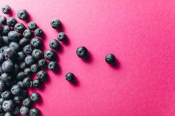Blueberries on a pink background