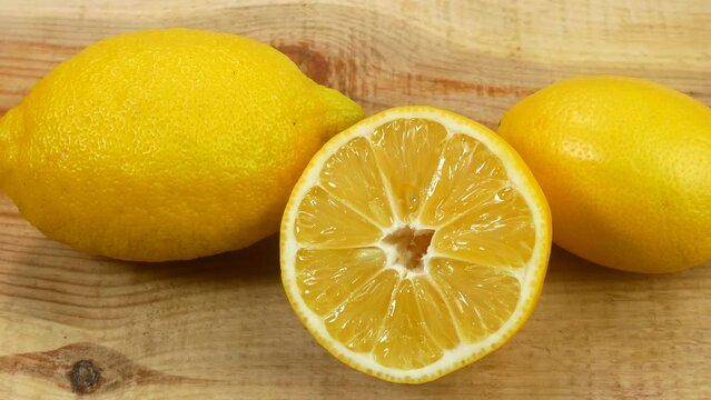Many fresh fruits lie on the table. Beautiful lemons for healthy eating. Citruses lie beautifully on a white table.