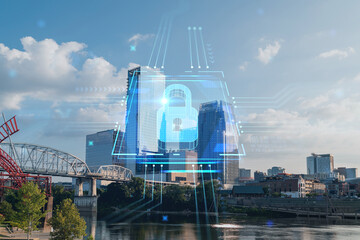 Panoramic skyline view of Broadway district of Nashville over Cumberland River at day time, Tennessee, USA. Glowing Padlock hologram. The concept of cyber security to protect confidential information