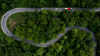 Aerial top view large freight transporter semi truck on the highway road, Truck driving on asphalt...