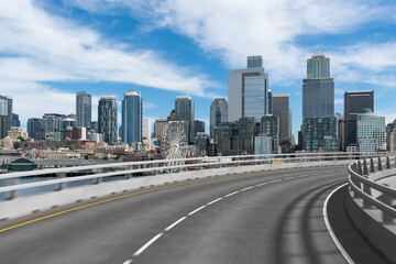 Fototapeta na wymiar Empty urban asphalt road exterior with city buildings background. New modern highway concrete construction. Concept way to success. Transportation logistic industry fast delivery. Seattle. USA.