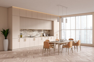 Stylish kitchen interior with dining corner near panoramic window