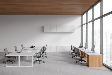 Light office room interior with coworking and meeting area, panoramic window