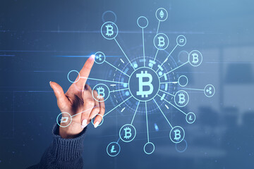 Fototapeta premium Woman finger touch cryptocurrency hologram icons and blockchain
