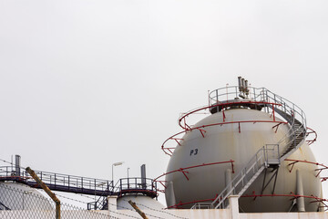 industrial complex. Hydrocarbon refinery. Spherical metal deposits. Cloudless blue sky. Lanzarote,...