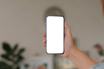 Close up of Man holding mobile phone with white background.