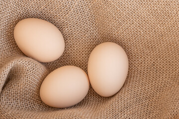 eggs against a background of burlap. Farm. Easter Eggs