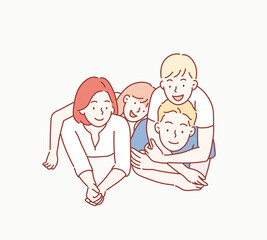 Beautiful and happy smiling young family in white T-shirts are hugging and have a fun time together while lying on the floor and looking on camera. Hand drawn style vector design illustrations.
