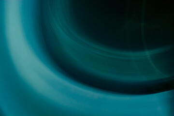 Abstract background of circles and waves in blue, turquoise and dark colors.