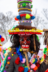 Gody Zywieckie - traditional winter parade of 'Dziady', folk custom in Zywiec region, man dressed in traditional colorful costume of a Jew, Milowka, Poland