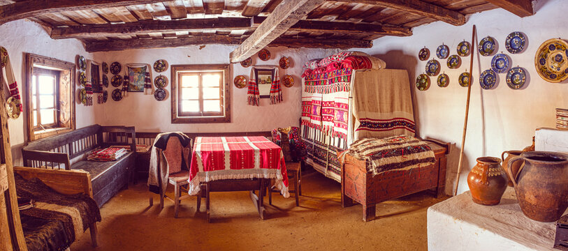 Sibiu, Romania - February 11, 2023. Traditional Romanian folk house interior with rural furniture and decoration. Astra Museum of Traditional Folk Civilization, Sibiu