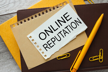 ONLINE REPUTATION. text on torn paper. notepad paper.