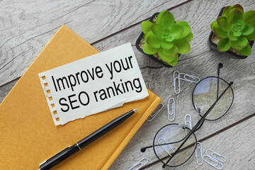 Improve your SEO ranking, text on torn paper near glasses and potted plants. Branding Concept