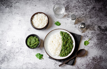 Spinach dahl with rice in a plate