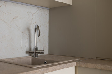 Countertop sink in the kitchen in a modern interior