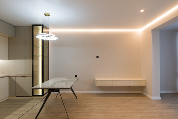 Modern kitchen in the interior of a new apartment in beige tones