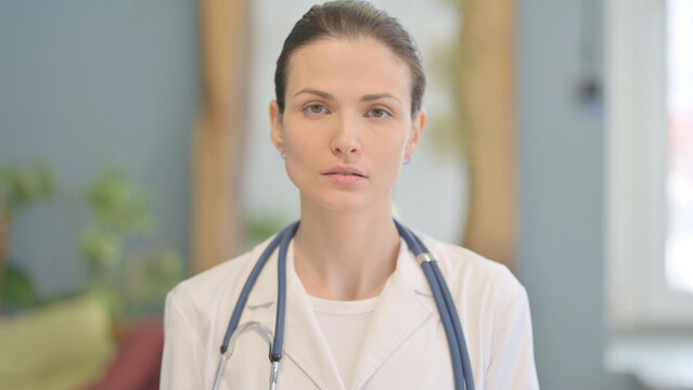 Portrait Of Serious Female Doctor Looking At The Camera