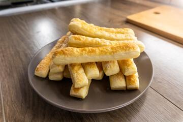puff pastry sticks on a wooden background. Food concept. Bakery.