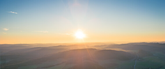 calm and simplistic sunset over the mountains background