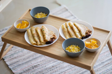 Healthy western breakfast, pancakes, nutes and fruites. Picnic breakfast