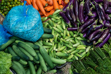 Fresh vegetable place neatly in the market or grocery store. Carrot, tomato, cucumber, lettuce, cabbage, broccolli, eggplant, chilli, lady finger, lime and etc