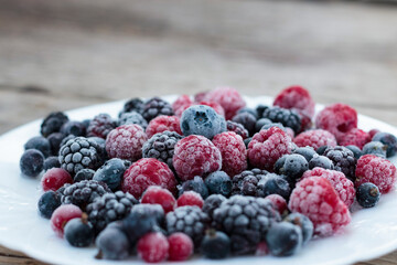 Frozen berries in a bowl, close-up