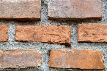 Red brick wall texture, abstract brickwork. Brick wall of an old building. Selective focus.